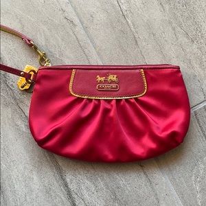 Hot pink satin Coach clutch / wristlet